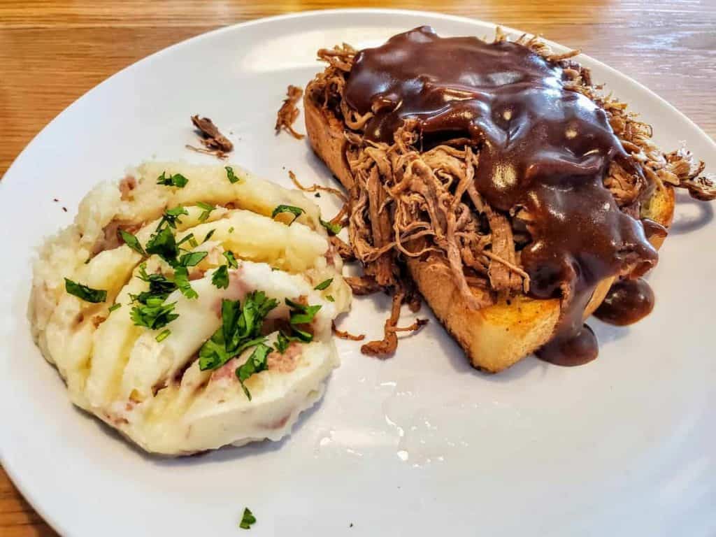 The open face roast beef sandwich is hearty and delicious
