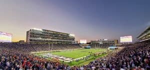 Crowded football stadium at twilight