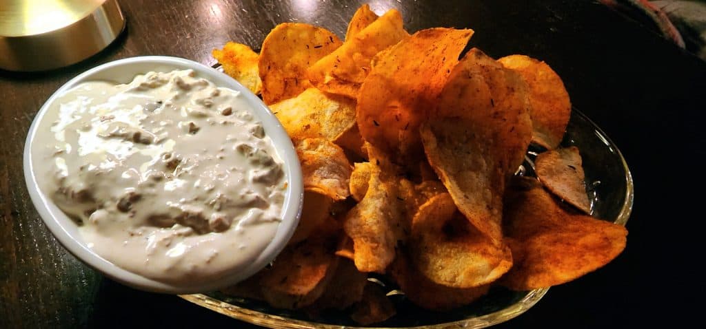 Potato chips with onion dip appetizer.