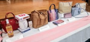 A table full of purses on a table.