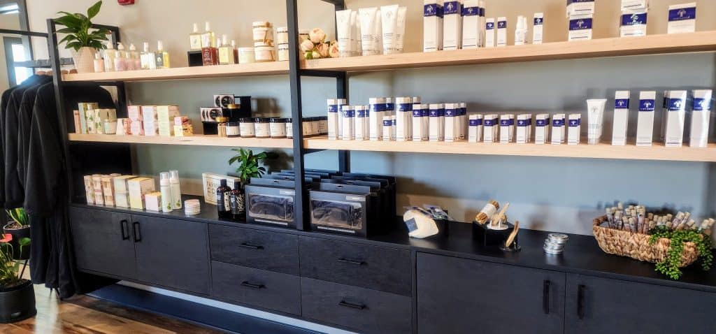 A hair salon with shelves full of products.