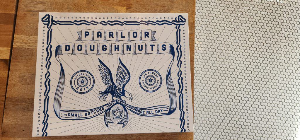 A poster with the words paul doughnuts on it.