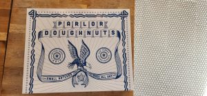 A poster with the words paul doughnuts on it.