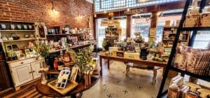 The interior of a store with a lot of items on display.