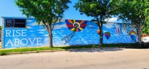 Inspirational mural with flower and hot air balloons.