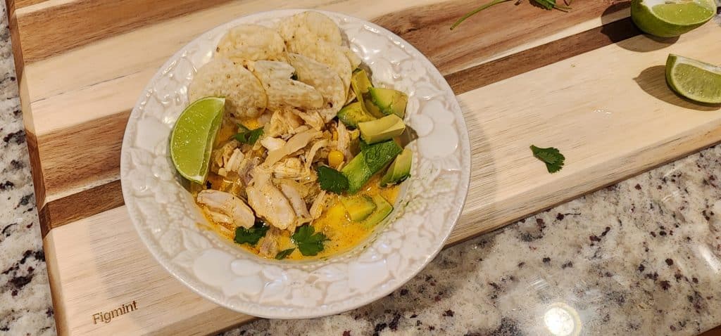 Chicken soup with avocado and lime.