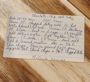 Handwritten chocolate chip date cake recipe card
