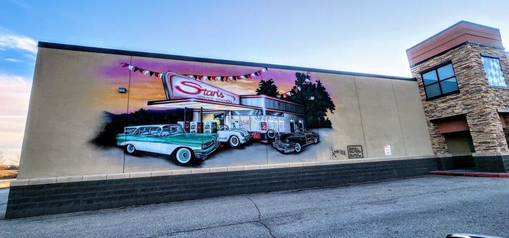 Retro mural of cars at Stan's Service Station.