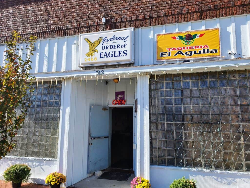 A building with a sign that says "eagles" is located in Manhattan, KS.