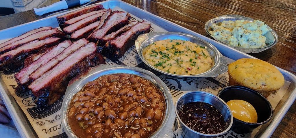A tray of ribs and cornbread on a table at Aggieville Brewing Company in Manhattan, KS.