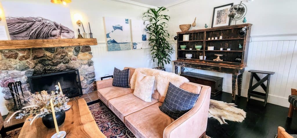 A living room with a fireplace and a couch.